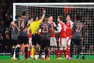 LONDON, ENGLAND - MARCH 07:  Laurent Koscielny of Arsenal (C) reacts as he is shown a red card by referee Anastasios Sidiropoulos and is sent off during the UEFA Champions League Round of 16 second leg match between Arsenal FC and FC Bayern Muenchen at Emirates Stadium on March 7, 2017 in London, United Kingdom.  (Photo by Shaun Botterill/Getty Images)